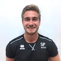 Head of Joe smiling at camera.