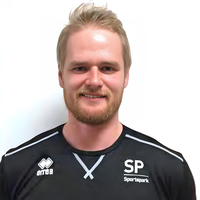 Headshot of Adam smiling at camera