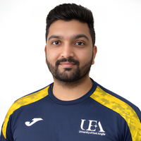 Headshot of Sahil against white background looking at camera.