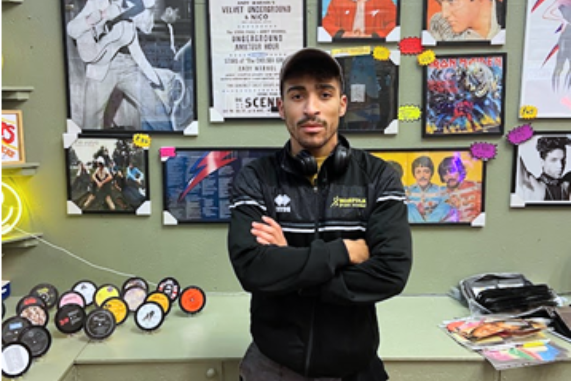 Ethan Kirby standing arms folded looking at camera.