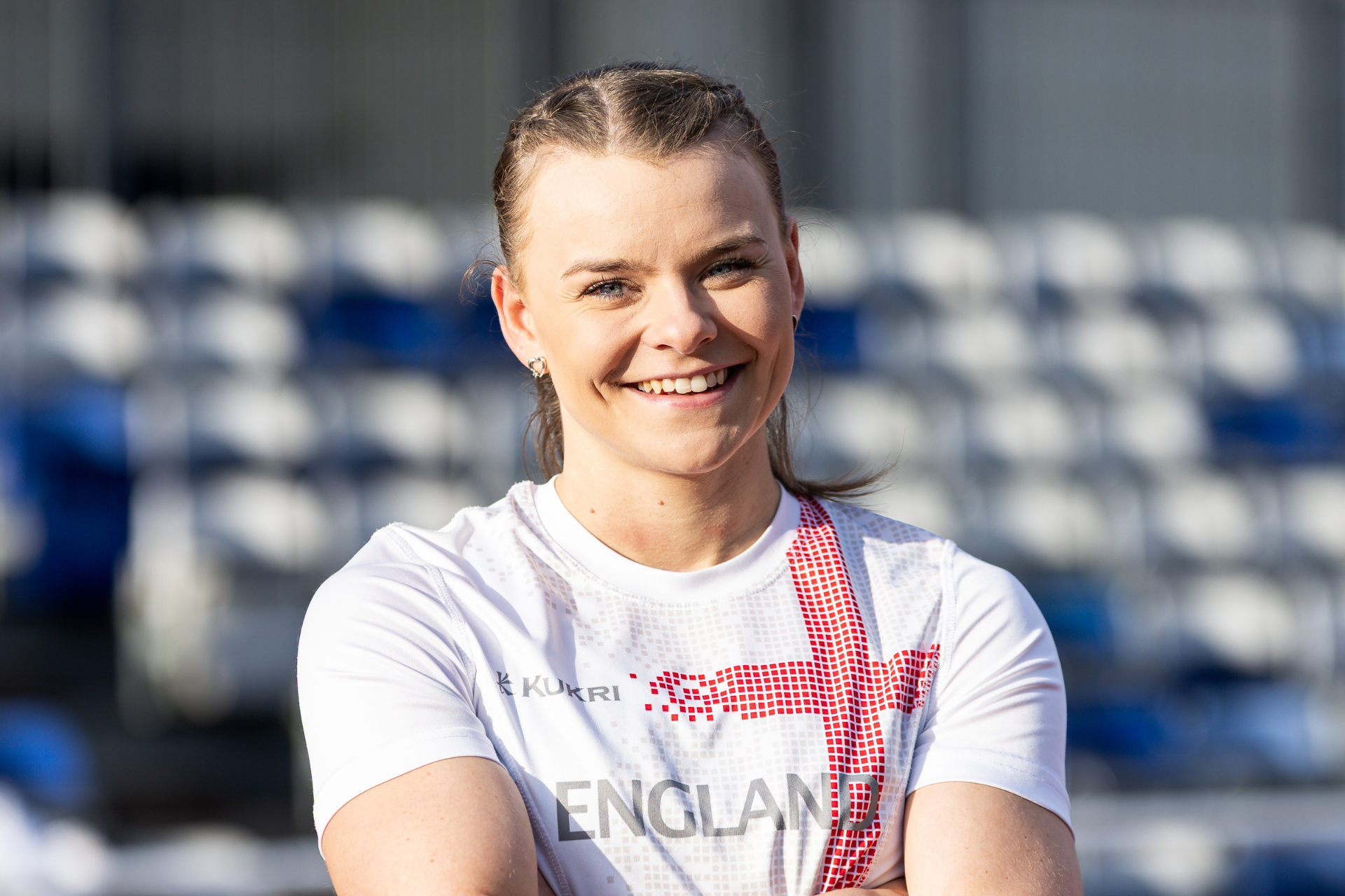 Ellie Mae Rogers smiling at camera in Team England top.