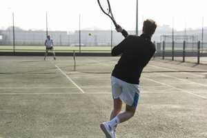 tennis player swinging