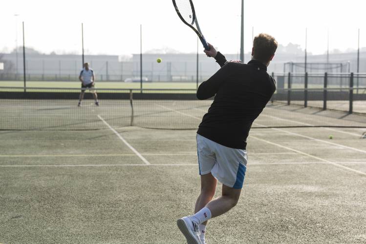 tennis player swinging