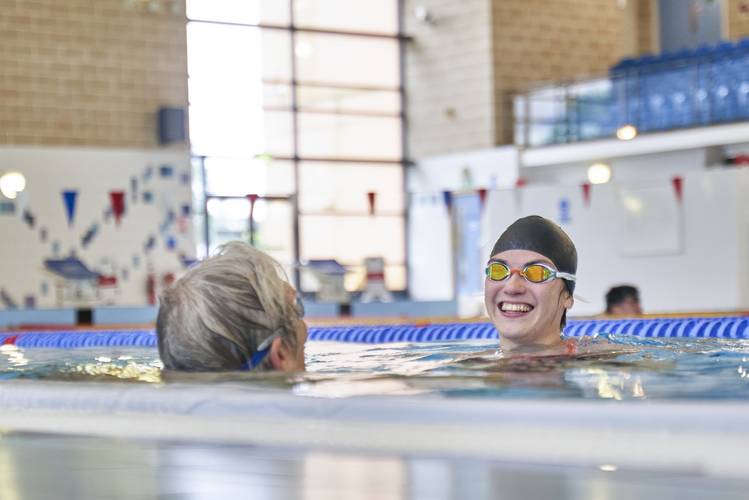 two people socialising in swimming pool