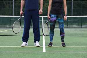 tennis courts with players standing still