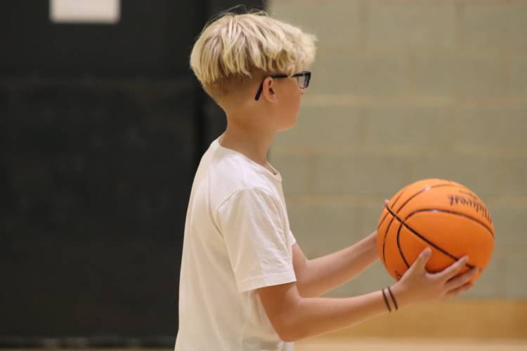 boy holding basketball