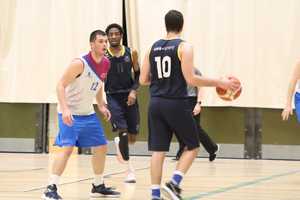 men playing basketball in sportshall
