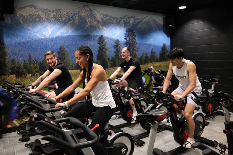 students sat on bikes using cycle studio