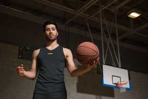 person holding basketball